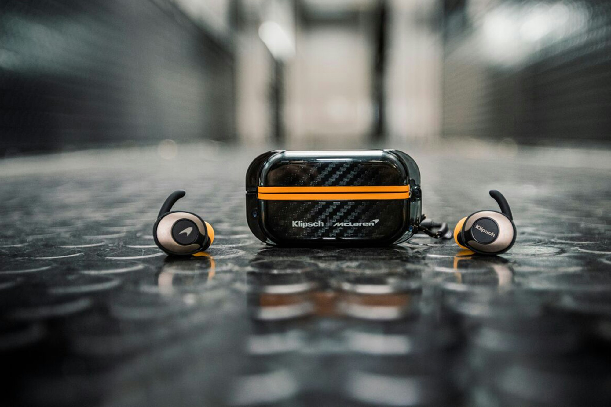 T5 II True Wireless Mc Laren Sport headphones industrial floor
